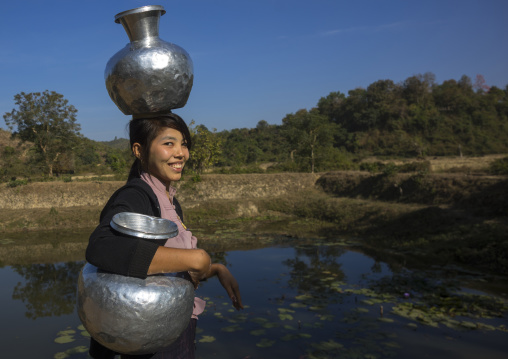 Woman Walking With Water Backet On Her Head Mrauk U, Myanmar