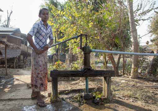 Rohingya Girl Pumping Water, Thandwe, Myanmar