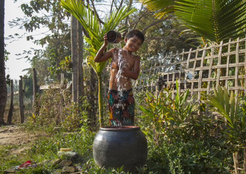 Rohingya Child Having A Bath, Thandwe, Myanmar