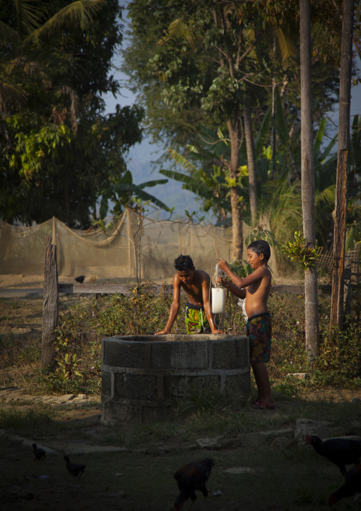 Rohingya Children In Front Of The Village Well, Thandwe, Myanmar