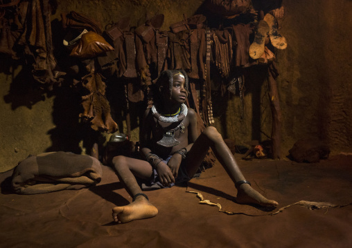 Young Himba Girl With Ethnic Hairstyle In Her Hut, Epupa, Namibia