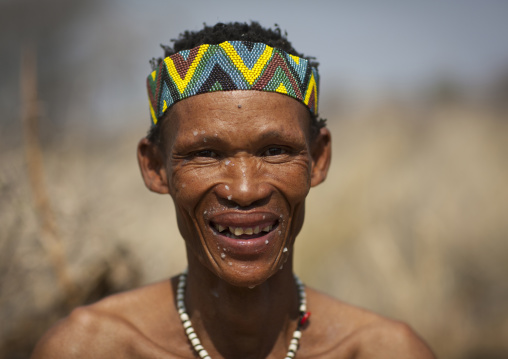 San Man With The Face Spattered With The Pulp Of The Water Tuber, Namibia