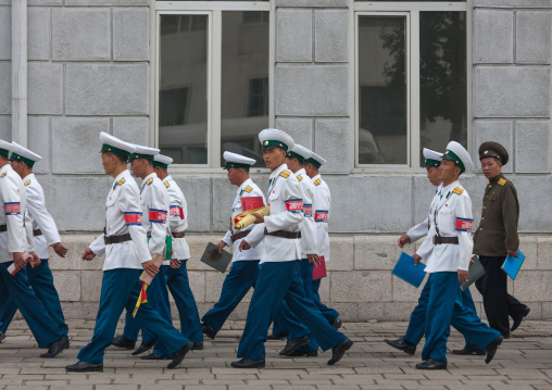 Group of North Korean male traffic security officers in white uniforms in the street, Pyongan Province, Pyongyang, North Korea