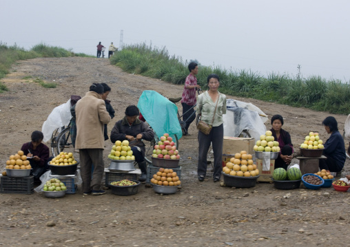 North Korean people selling fruits in a market in the countryside, North Hwanghae Province, Sariwon, North Korea