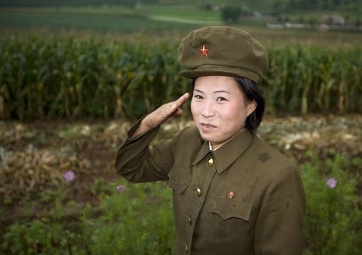 North Korean female soldier saluting in the countryside, North Hwanghae Province, Kaesong, North Korea