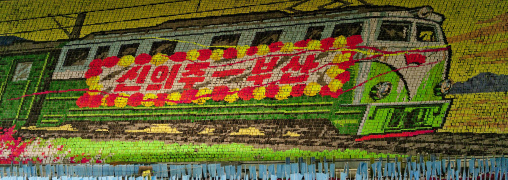 Train of reunification made by children pixels holding up colored boards during Arirang mass games in may day stadium, Pyongan Province, Pyongyang, North Korea