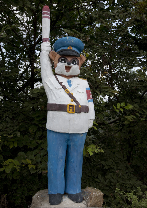 Funny statue of a North Korean traffic security officer in white unform in a park, Pyongan Province, Pyongyang, North Korea