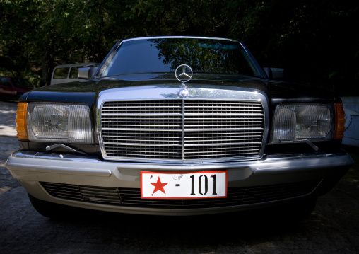 Officials mercedes car with a red star on the plate, Pyongan Province, Pyongyang, North Korea