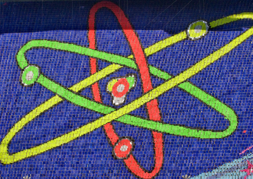 Nuclear atom made by children pixels holding up colored boards during Arirang mass games in may day stadium, Pyongan Province, Pyongyang, North Korea