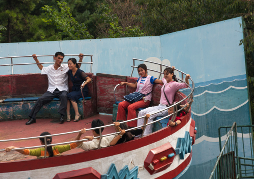 North Korean people enjoying an attraction in Taesongsan funfair, Pyongan Province, Pyongyang, North Korea