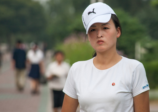 Portrait of a North Korean woman wearing a Puma cap, Pyongan Province, Pyongyang, North Korea