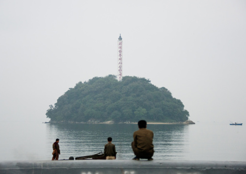 North Korean people sitting and looking at seaside island, South Hamgyong Province, Hamhung, North Korea