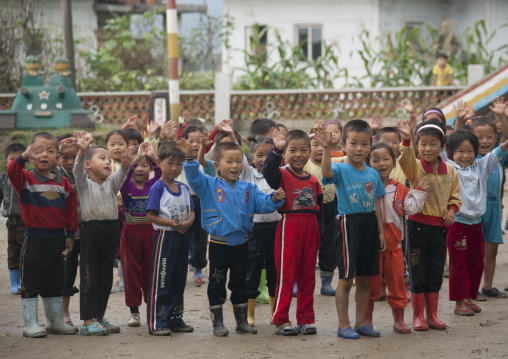 Group of North Korean children waving in a school, South Hamgyong Province, Hamhung, North Korea