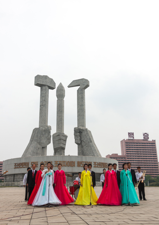North Korean state artist performing on national day in front of the monument to Party founding, Pyongan Province, Pyongyang, North Korea