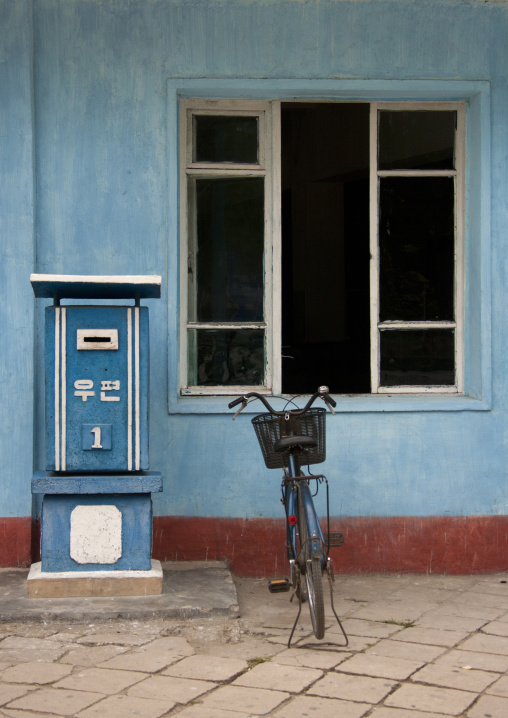 A bicycle parked next to a mail box, North Hwanghae Province, Kaesong, North Korea