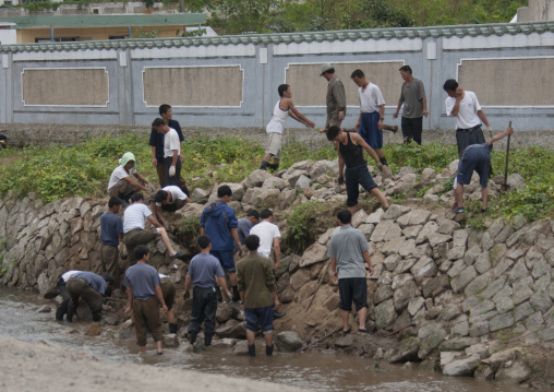 North Korean men repairing the river banks wall after a flood, North Hwanghae Province, Kaesong, North Korea