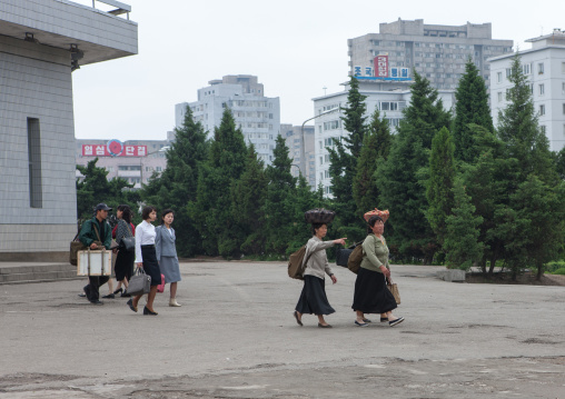 North Korean women carrying stuff on their heads, Pyongan Province, Pyongyang, North Korea