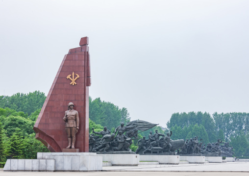 North Korean soldier statue with the workers' Party of North Korea flag, Pyongan Province, Pyongyang, North Korea