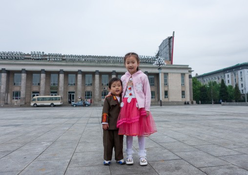 North Korean girl with her brother dressed as a soldier in Kim il Sung square, Pyongan Province, Pyongyang, North Korea