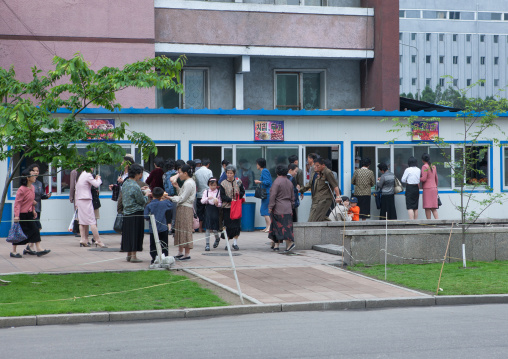 North Korean people buying food in a street restaurant, Pyongan Province, Pyongyang, North Korea
