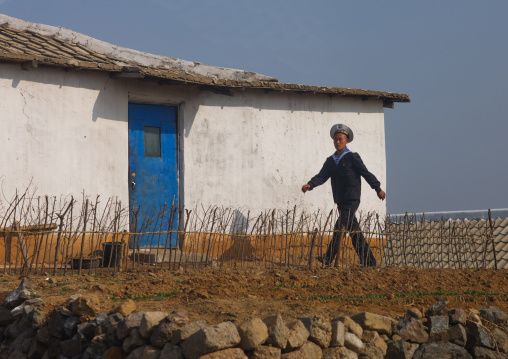North Korean navy sailor in front of a house in the countryside, South Pyongan Province, Nampo, North Korea