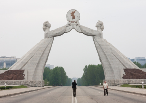 Tourists taking pictures at the reunification monument on the highway, Pyongan Province, Pyongyang, North Korea