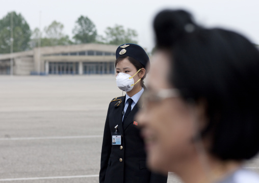 North Korean woman wearing a flu mask in Sunan international airport, Pyongan Province, Pyongyang, North Korea