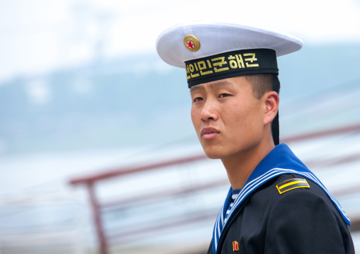 North Korean navy sailor in front of the us spy boat Uss Pueblo, Pyongan Province, Pyongyang, North Korea