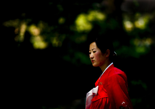 North Korean woman in red choson-ot, Hyangsan county, Mount Myohyang, North Korea