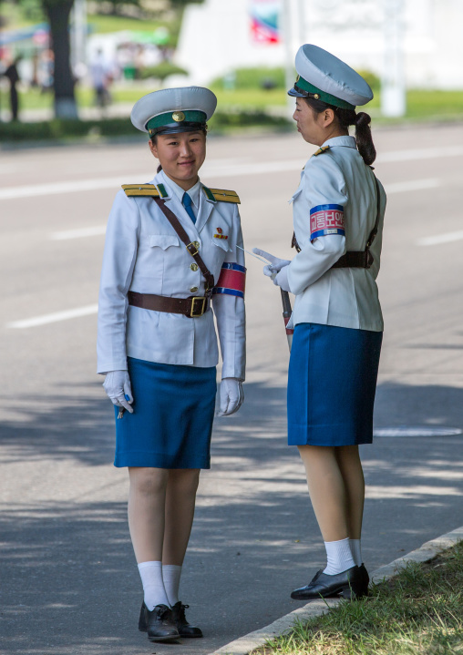 North Korean traffic security officers in white uniforms in the street, Pyongan Province, Pyongyang, North Korea