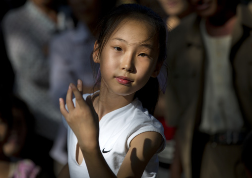 North Korean girl dancing in a park on september 9 day of the foundation of the republic, Pyongan Province, Pyongyang, North Korea