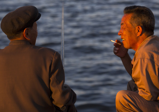 North Korean men fishing and chatting, Kangwon Province, Wonsan, North Korea