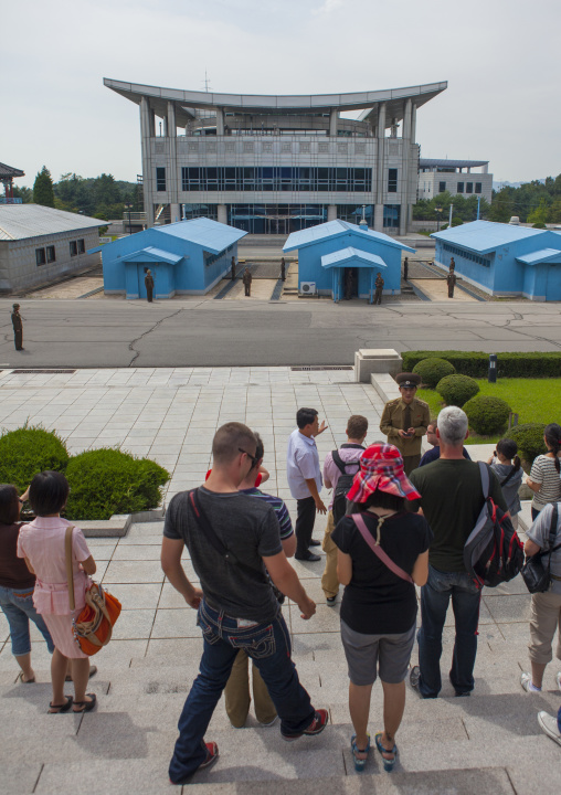 Tourists queueing to visit the conference room on the Demilitarized Zone, North Hwanghae Province, Panmunjom, North Korea