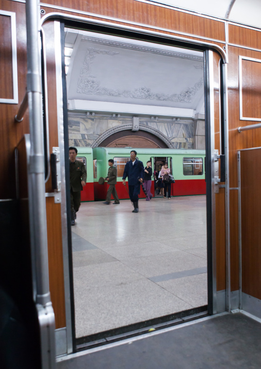 North Korean people coming out from a train in the subway, Pyongan Province, Pyongyang, North Korea