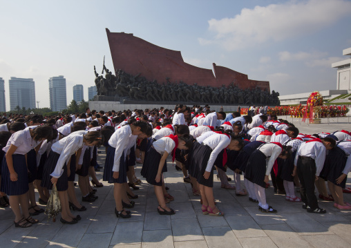 North Korean pioneers from the Korean children's union paying respect in the Grand monument on Mansu hill, Pyongan Province, Pyongyang, North Korea