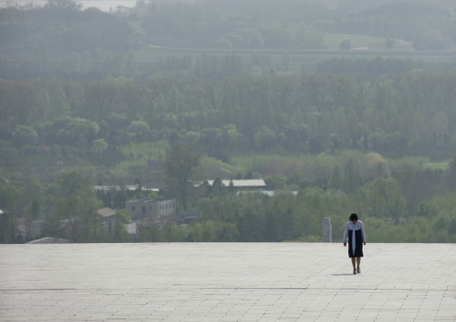 North Korean woman going to Taesongsan revolutionary martyr's cemetery, Pyongan Province, Pyongyang, North Korea