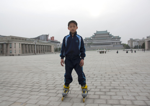 North Korean boy with rollers on Kim il Sung square, Pyongan Province, Pyongyang, North Korea