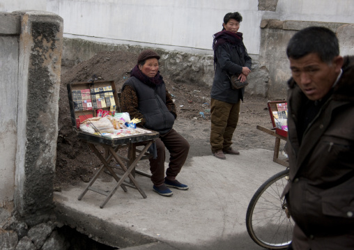 North Korean woman selling cigarettes in the street, North Hwanghae Province, Kaesong, North Korea