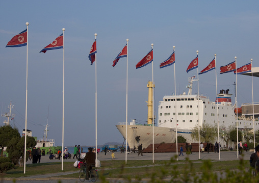 Ship in front of North Korean flags in the city, Kangwon Province, Wonsan, North Korea