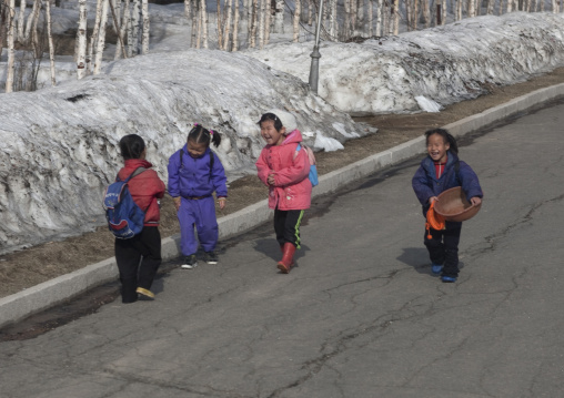 North Korean children going to school in a snowy road, Ryanggang Province, Samjiyon, North Korea