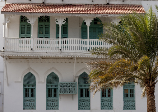 Old Omani White House With Green Carved Wooden Windows And Palm Tree, Muscat, Oman