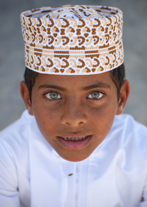 Green Eyed Boy Wearing Cap In Masirah Island, Oman