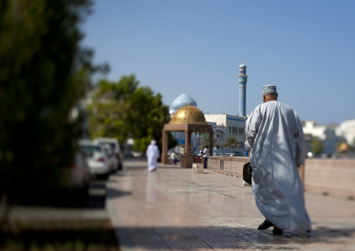 Man Walking On The Corniche In Muscat, Oman