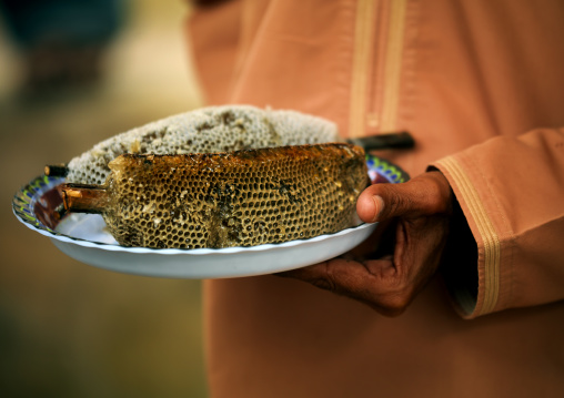 Honey Seller Holding A Plate Of Honeycomb, Nizwa, Oman