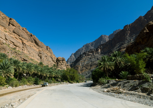 Truck on the road in a wadi, Al Hajar Mountains, Bilad Sayt, Oman