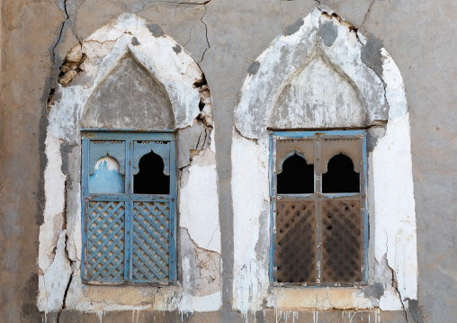 Wooden carved windows of an abandoned house, Dhofar Governorate, Mirbat, Oman