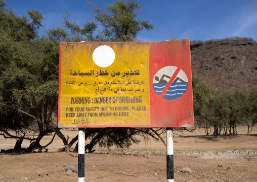 No swimming billboard in wadi dirba, Dhofar Governorate, Qara Mountains, Oman