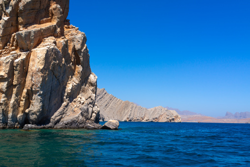 Fjords in front of mountains, Musandam Governorate, Khasab, Oman