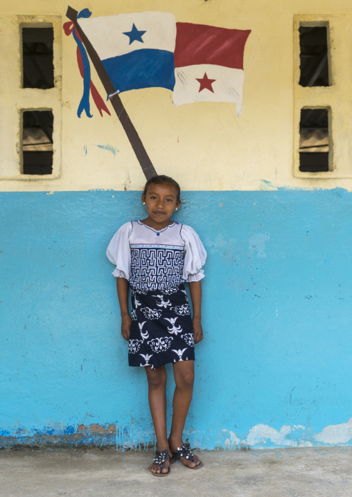 Panama, San Blas Islands, Mamitupu, Kuna Girl In A School In Front Of A Painting Of The Panama Flag