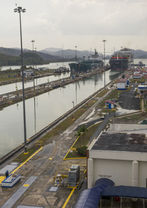 Panama, Province Of Panama, Panama City, Container Ship Passing Through The Miraflores Locks In The Panama Canal